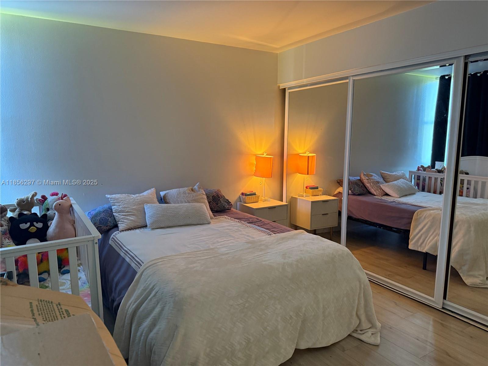 16919 North Bay Road, Unit 710 Sunny Isles Beach, FL 33160 - Photo 5 of 7 a bedroom with a bed and a couch