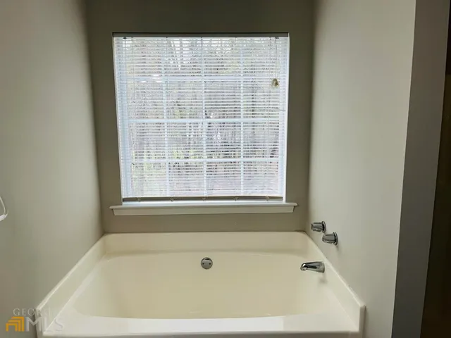 a bathroom with a sink a toilet and a bathtub