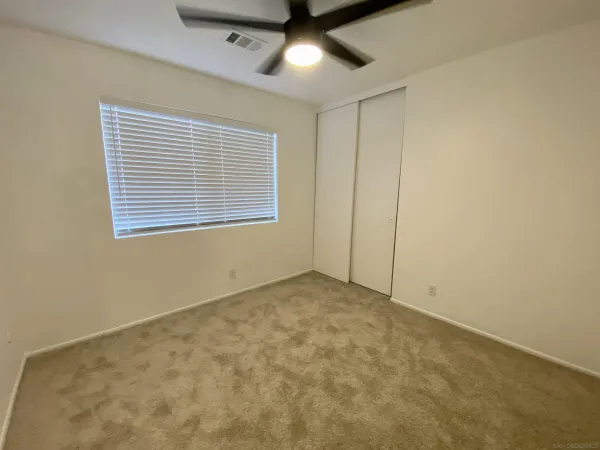 a kitchen with a stove and a refrigerator