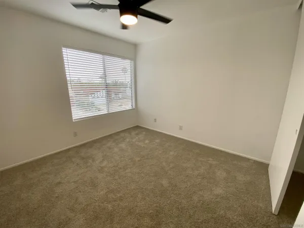 a bathroom with a double vanity sink mirror and shower