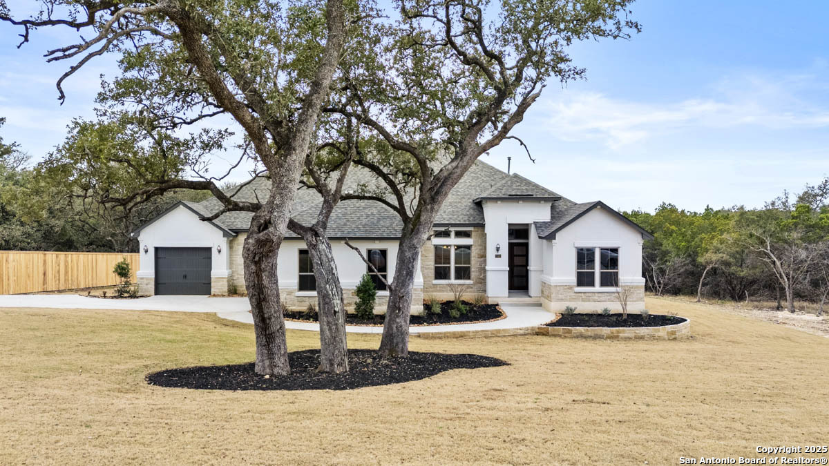 22405 Citadel Point Garden Ridge, TX 78266 - Photo 1 of 1 a front view of a house with a yard