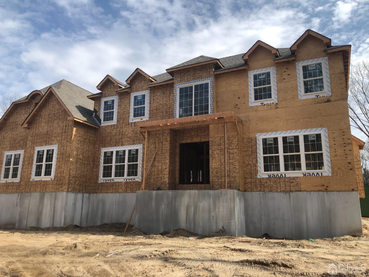 a front view of a house with a wooden fence