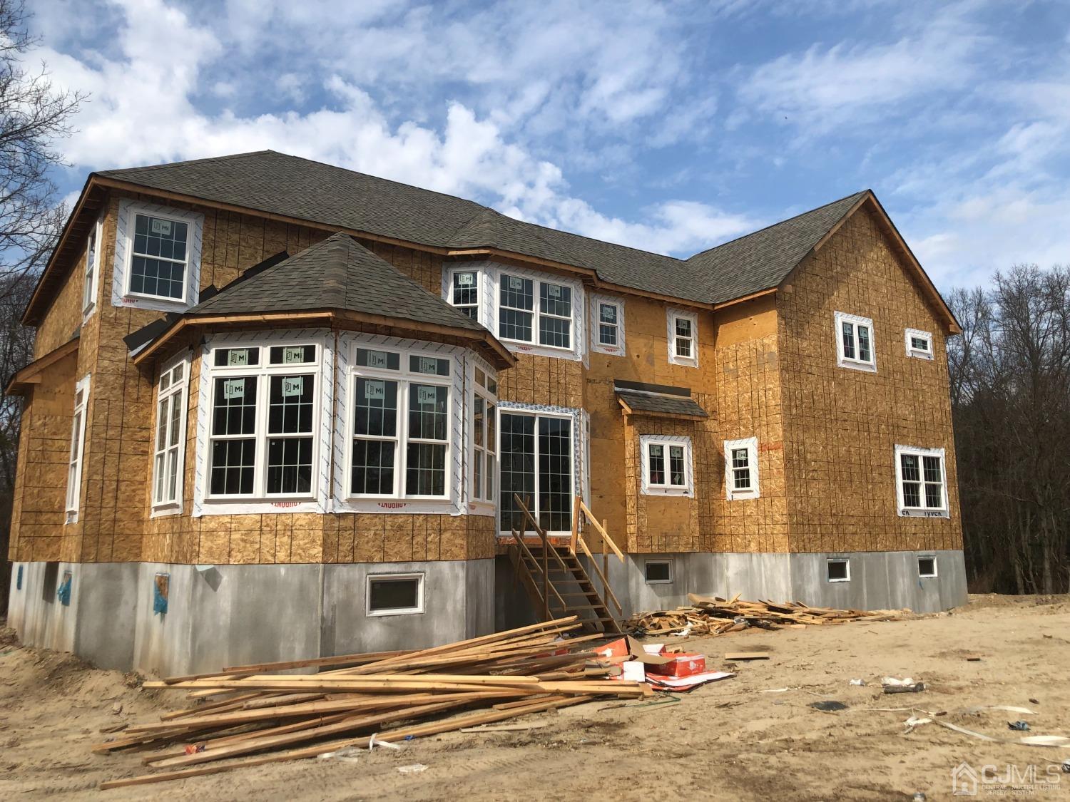 B Dutch Road East Brunswick, NJ 08816 - Photo 2 of 6 a front view of a house with a yard