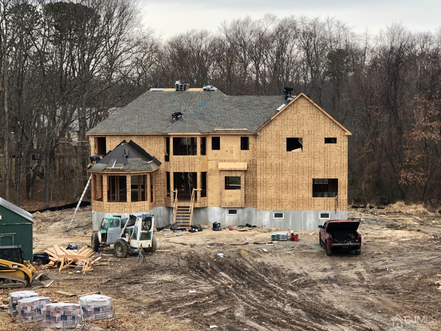 B Dutch Road East Brunswick, NJ 08816 - Photo 3 of 6 a view of a white house with large windows next to a road