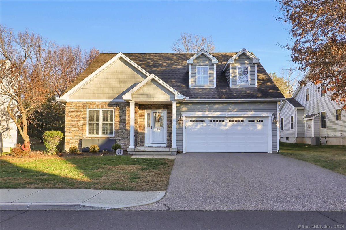 front view of a house with a yard