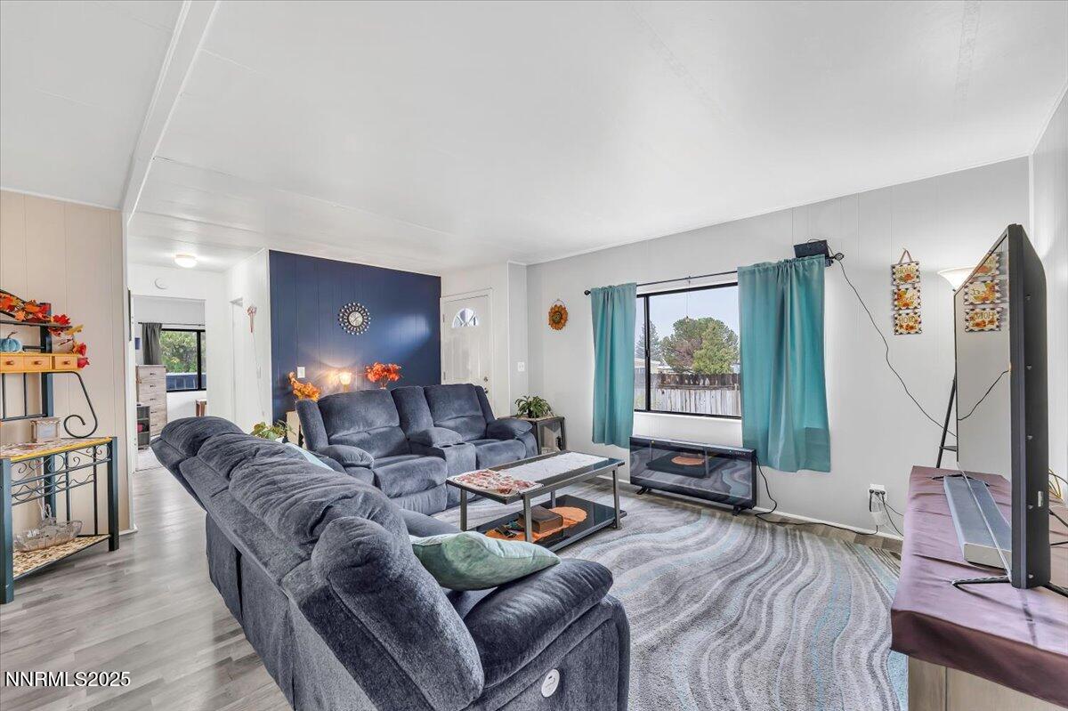 485 Capricorn Circle Reno, NV 89521 - Photo 14 of 31 a living room with furniture a air conditioner vent and a window