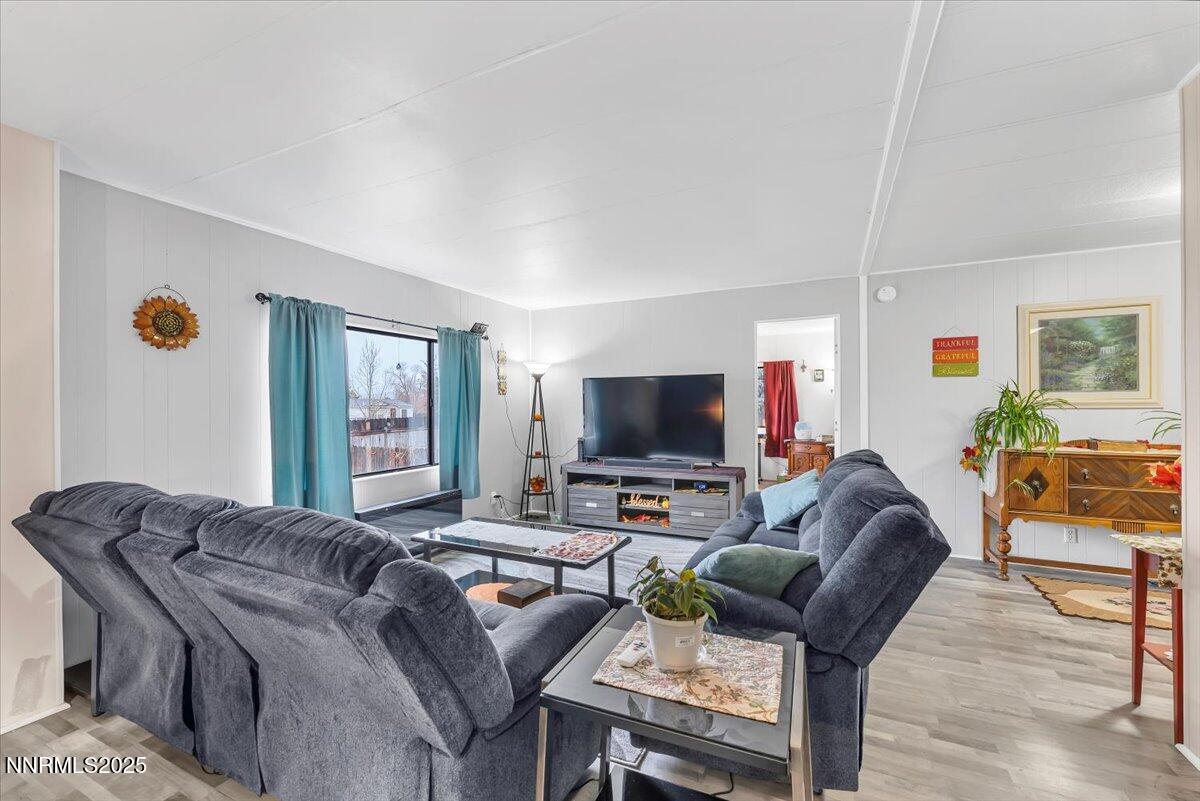 485 Capricorn Circle Reno, NV 89521 - Photo 15 of 31 a living room with furniture and a flat screen tv