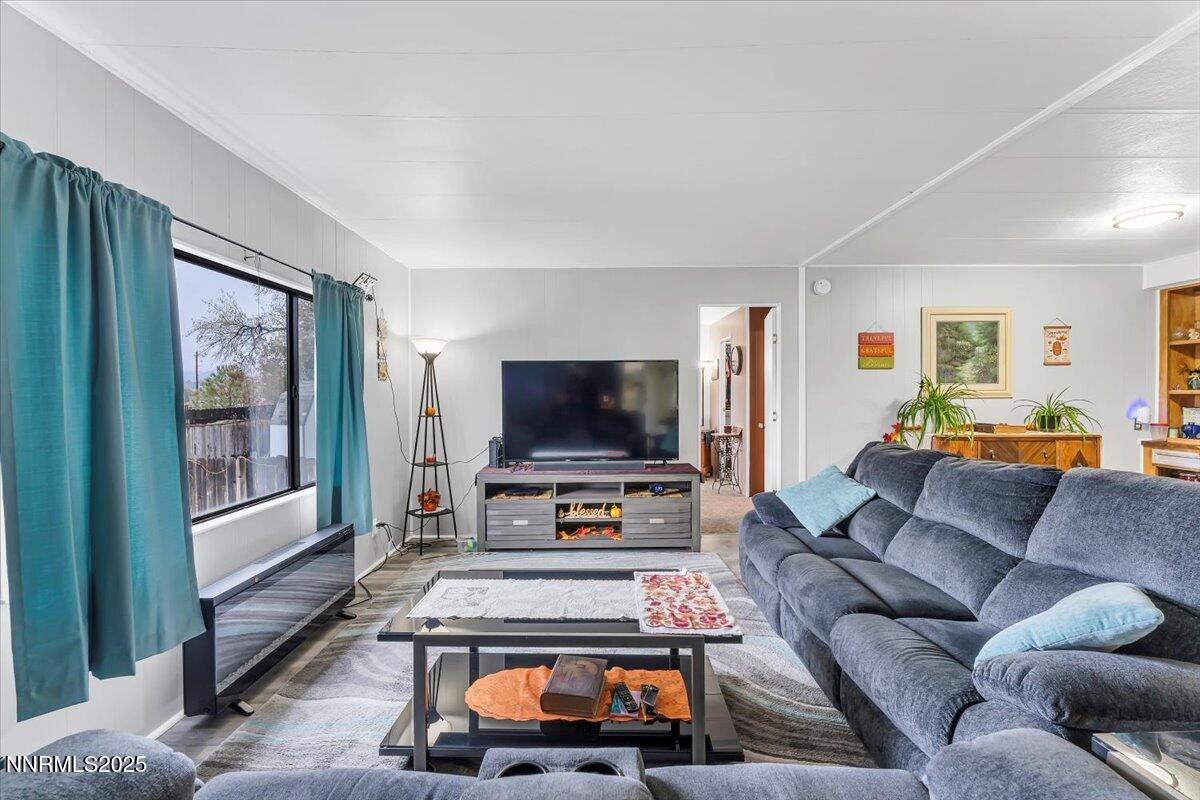 485 Capricorn Circle Reno, NV 89521 - Photo 16 of 31 a living room with furniture and a flat screen tv