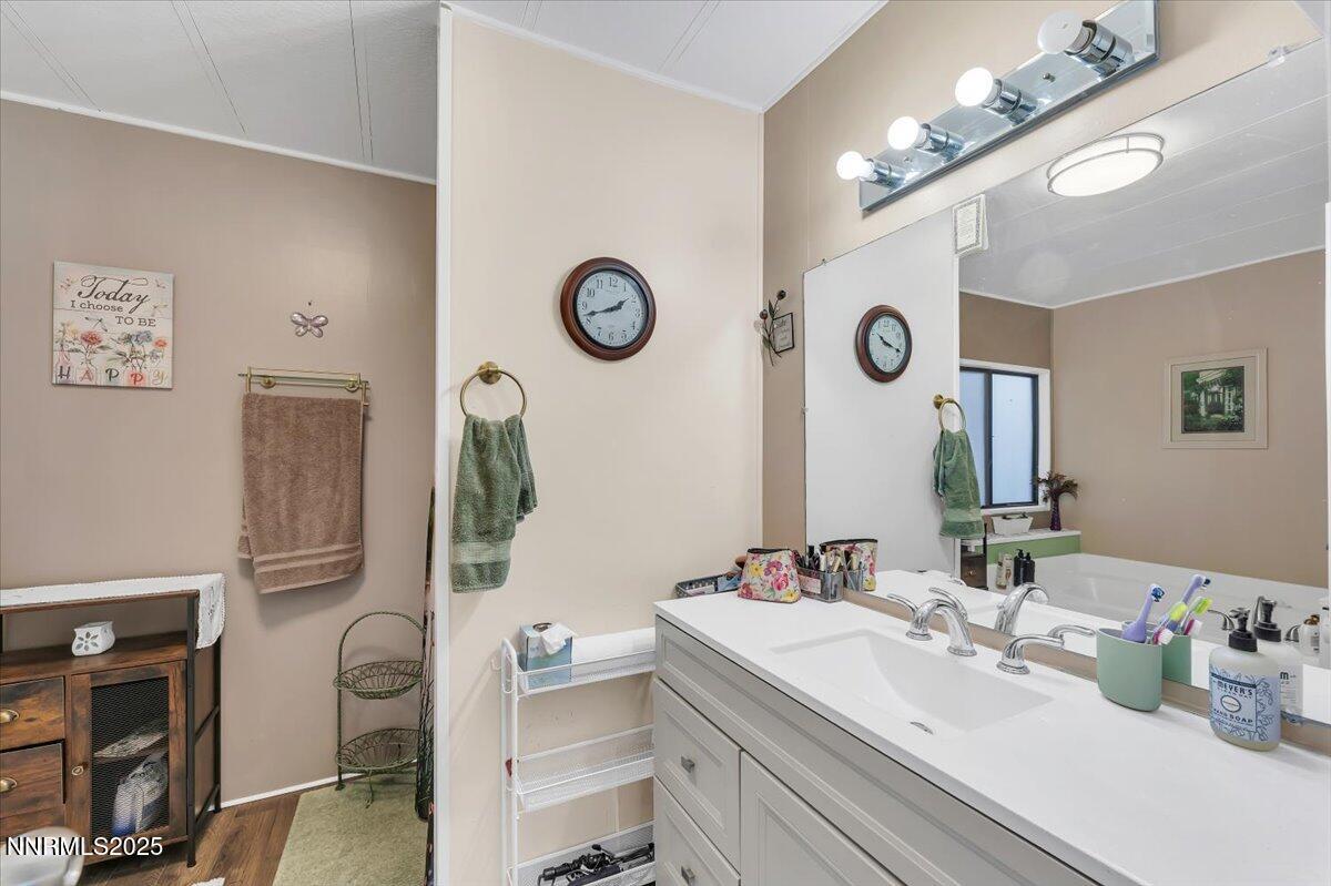 485 Capricorn Circle Reno, NV 89521 - Photo 21 of 31 a bathroom with a sink and a mirror