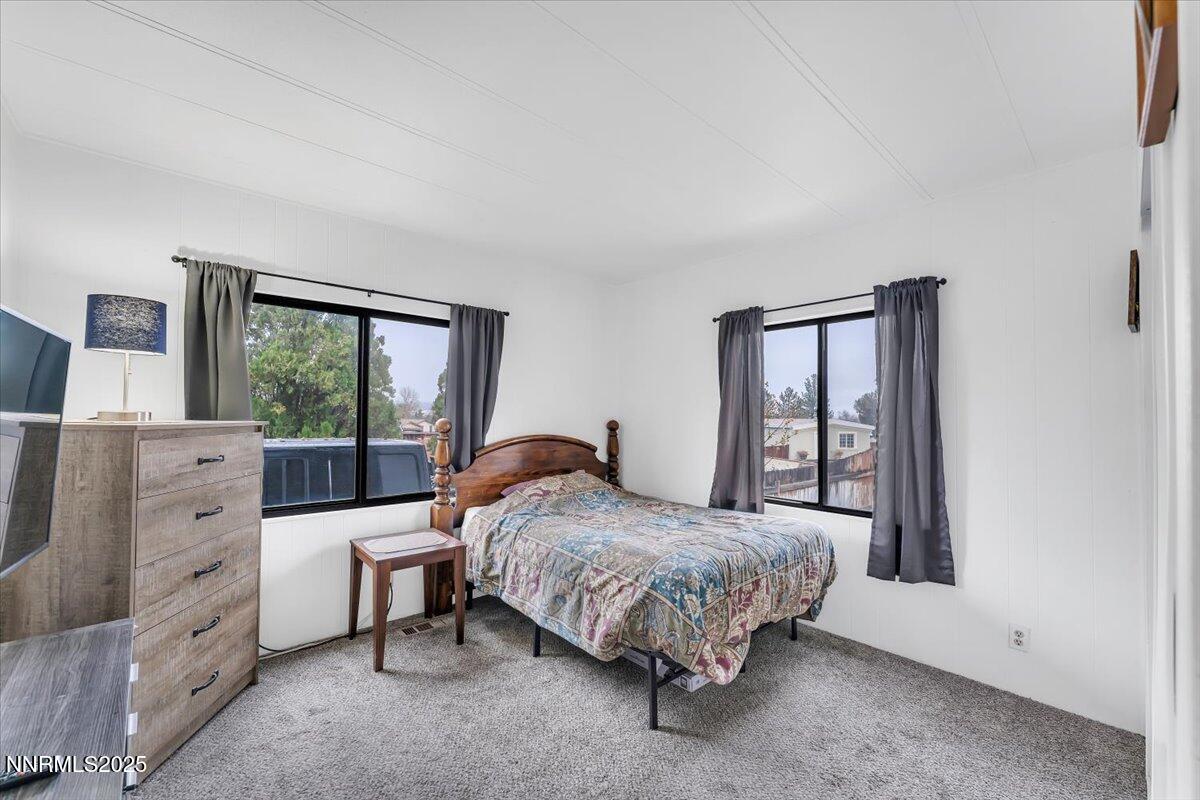 485 Capricorn Circle Reno, NV 89521 - Photo 23 of 31 a bedroom with a bed and a window