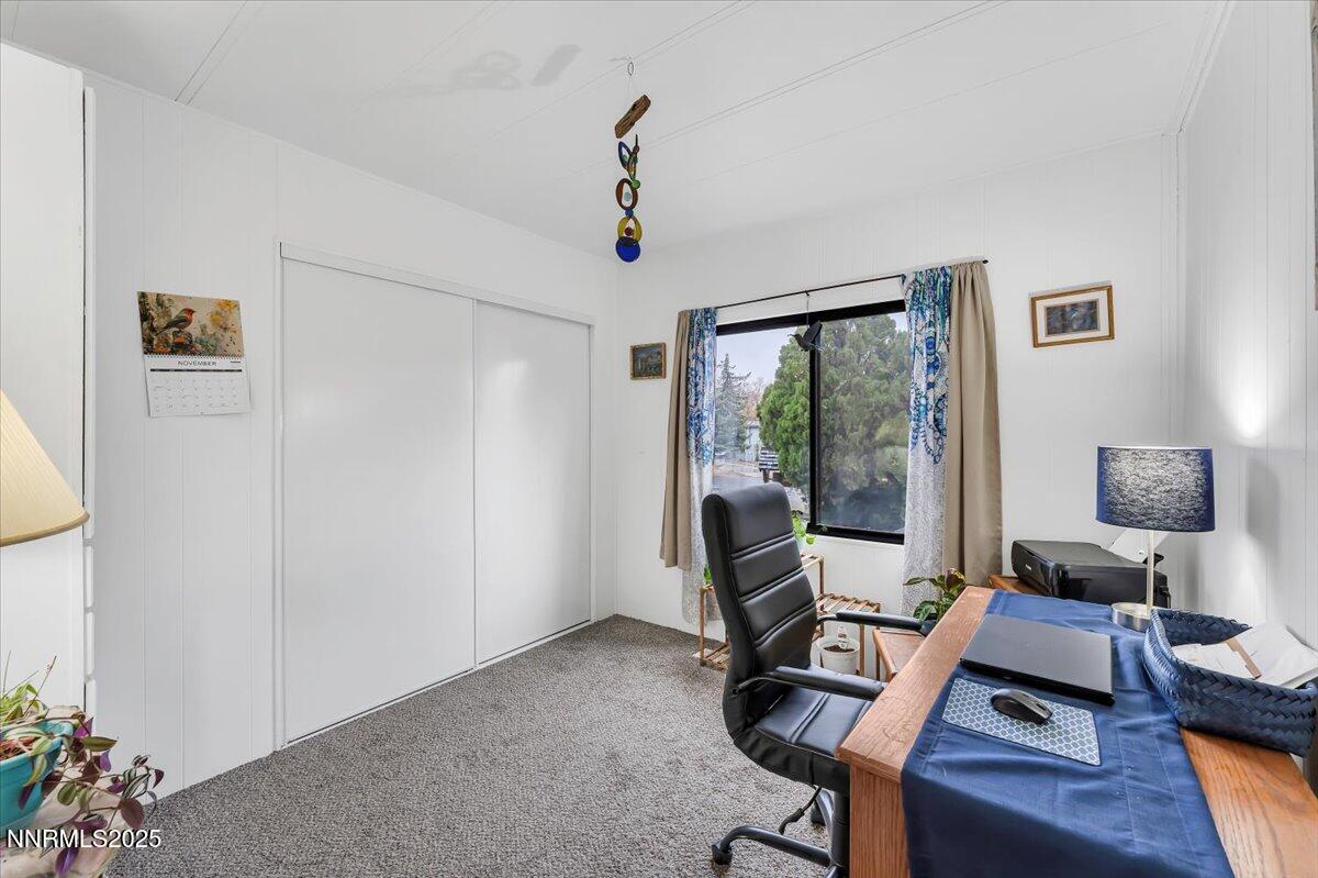 485 Capricorn Circle Reno, NV 89521 - Photo 24 of 31 a view of a workspace with furniture and a window