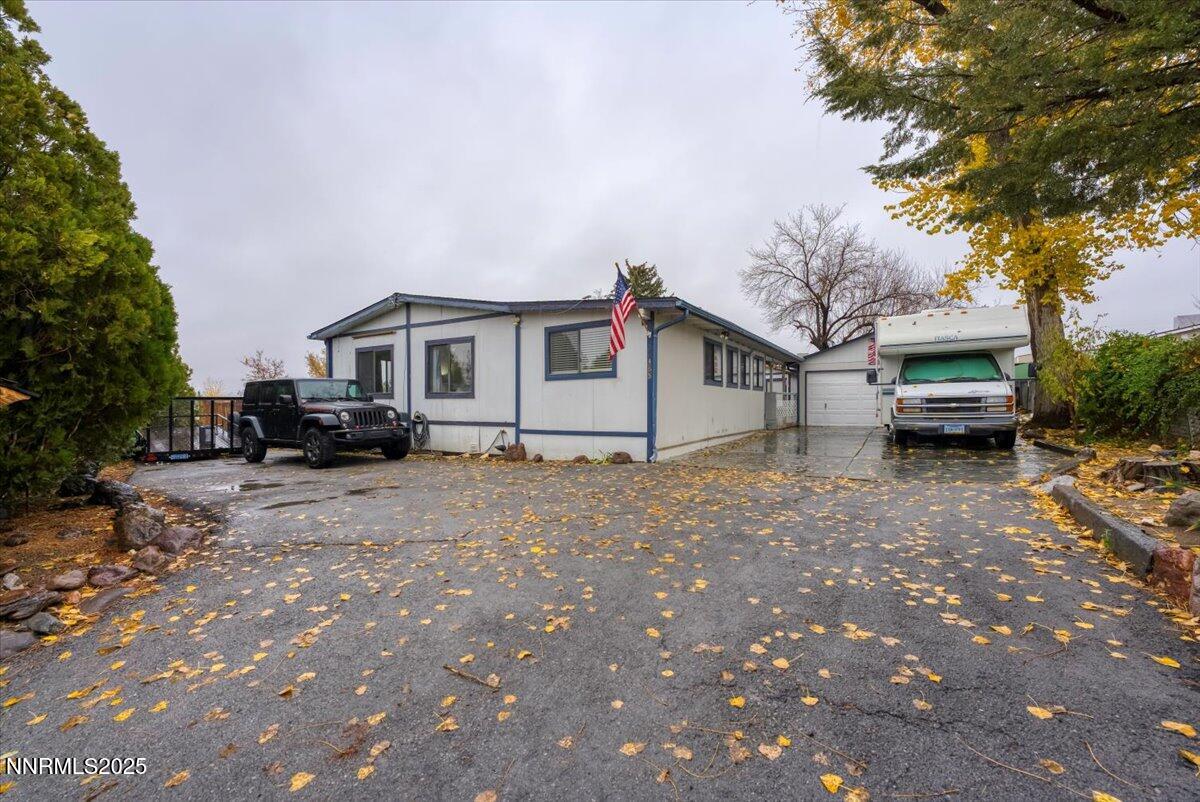 485 Capricorn Circle Reno, NV 89521 - Photo 3 of 31 a car parked in front of white house