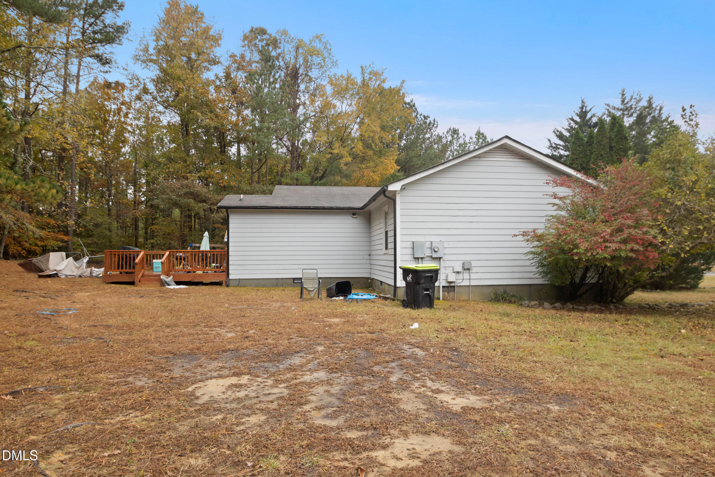 2930 Thomas Road Henderson, NC 27537 - Photo 15 of 17 a view of a house with a yard and garage