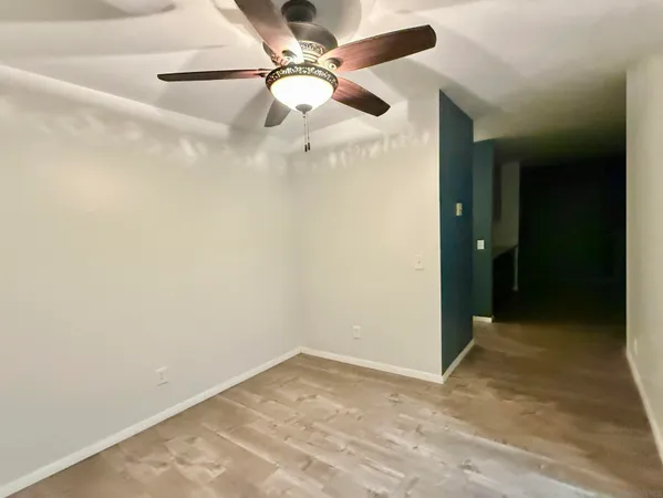 wooden floor in a hall with a window