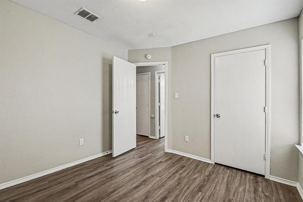 138 Kings Way Drive Rhome, TX 76078 - Photo 9 of 16 a view of an empty room with wooden floor