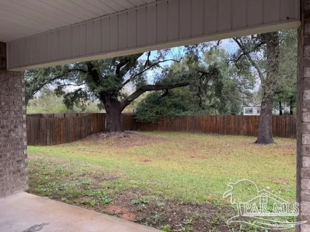 a backyard of a house with lots of green space