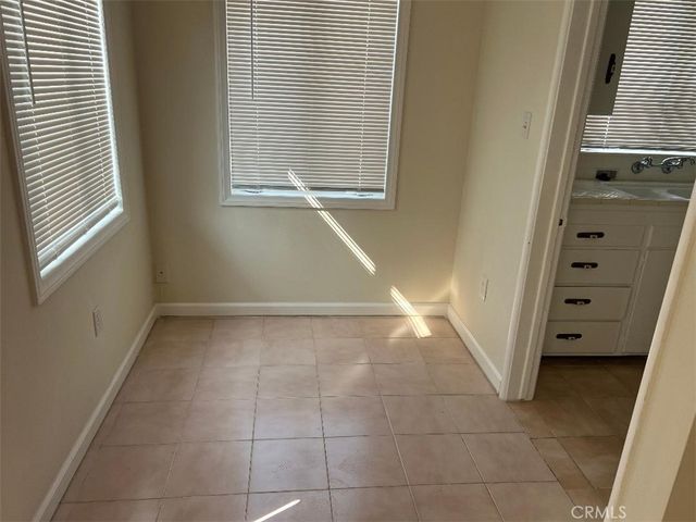 a bathroom with a bathtub and a window