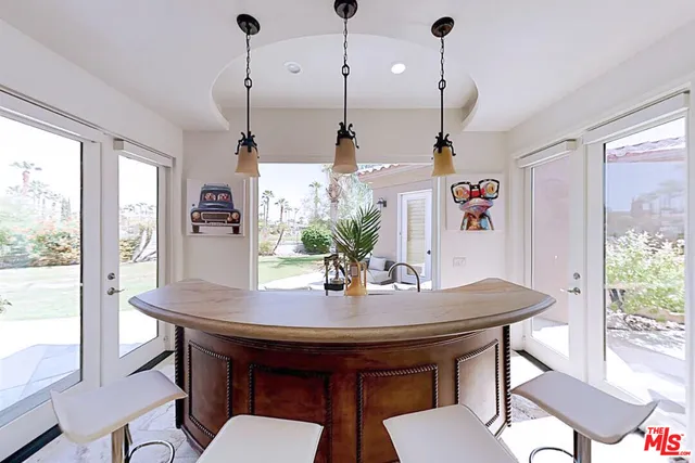 a view of a dining room with furniture window and outside view