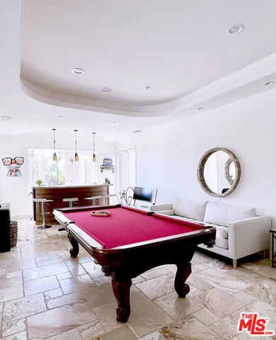 a room with table and pool table