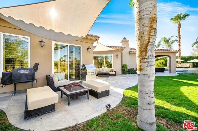 a swimming pool with outdoor seating yard and livingroom