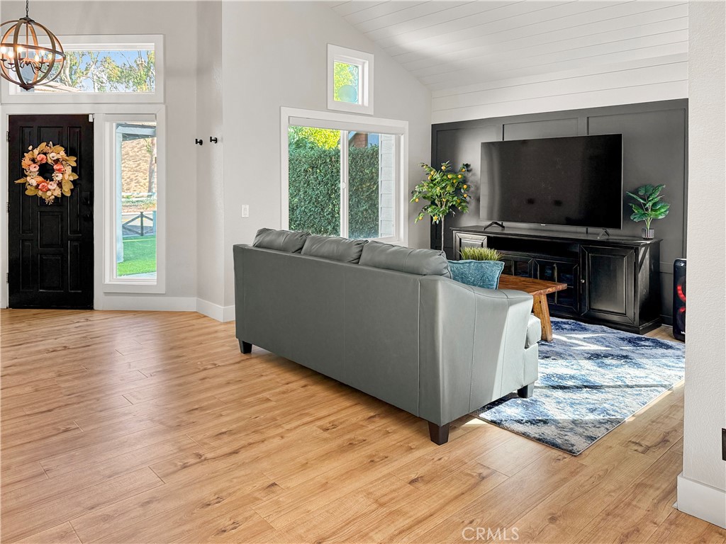 16955 Lake Knoll Parkway Riverside, CA 92503 - Photo 7 of 42 a living room with furniture and a flat screen tv