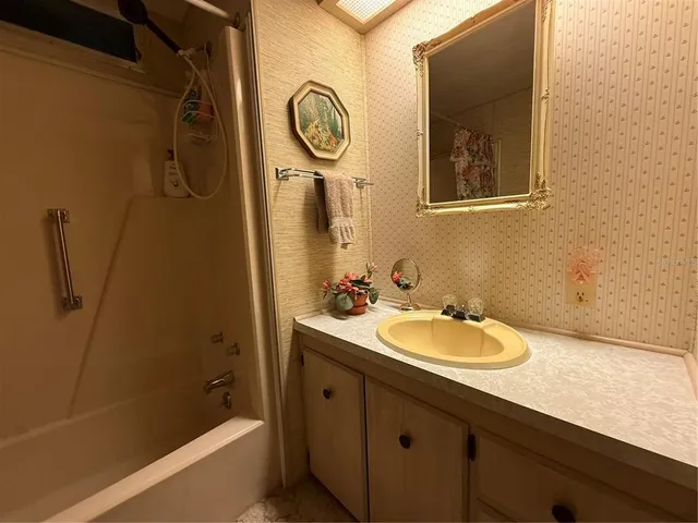 a view of a hallway with living room and closet