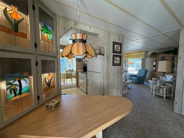 a living room with furniture a rug and a flat screen tv