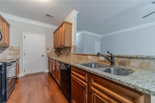 a kitchen with a sink and cabinets