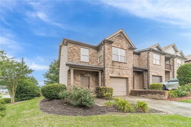 front view of a house with a yard