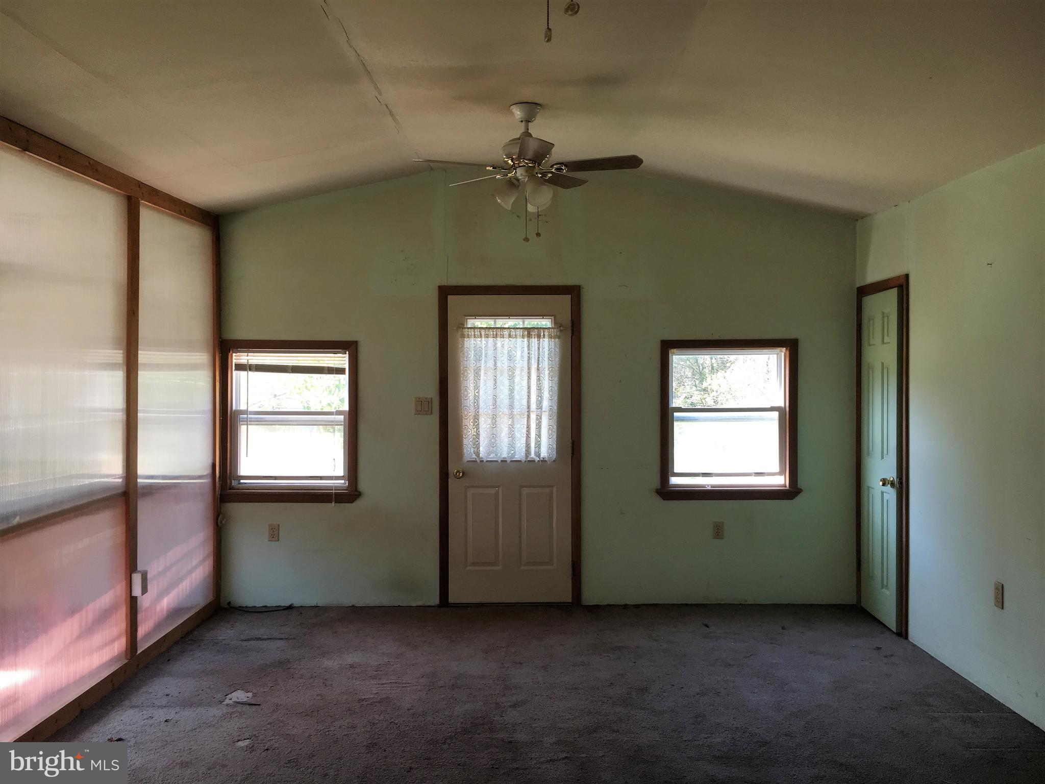 Living Rm w Sun Rm left, Laundry/util Rm right.