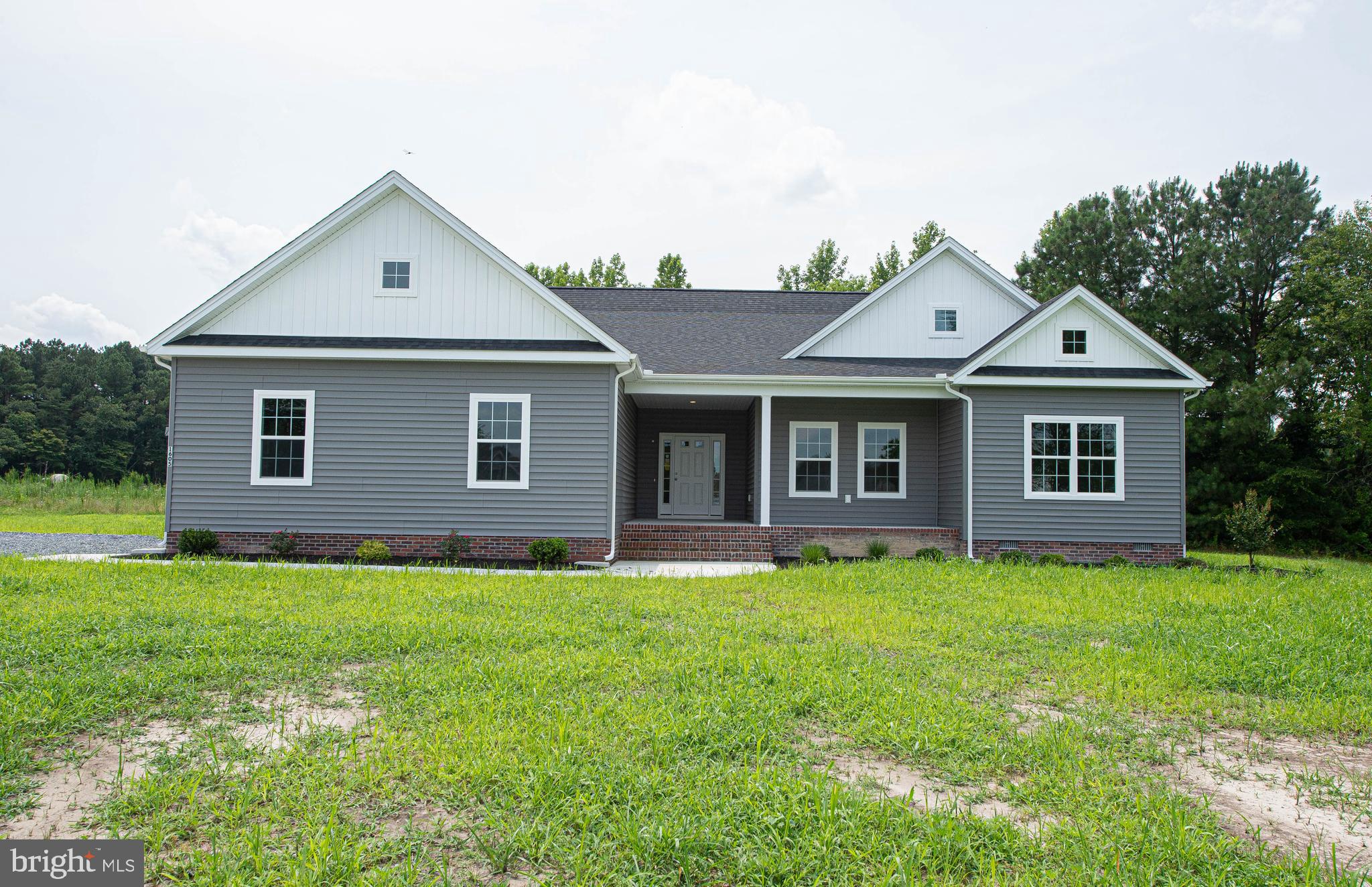 a front of a house with a garden