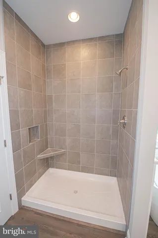 a bathroom with a shower and a bathtub
