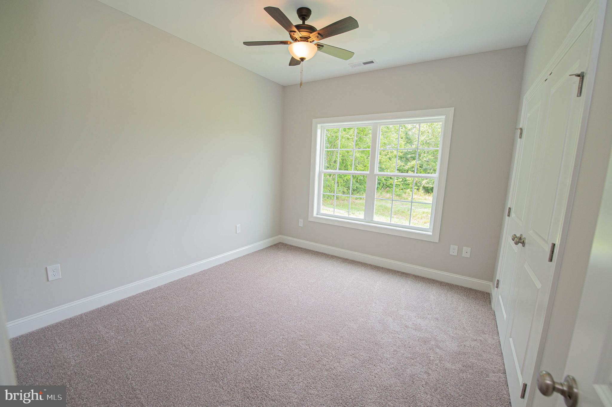 22372 Concord Pond Road Georgetown, DE 19947 - Photo 30 of 43 an empty room with a window and a fan