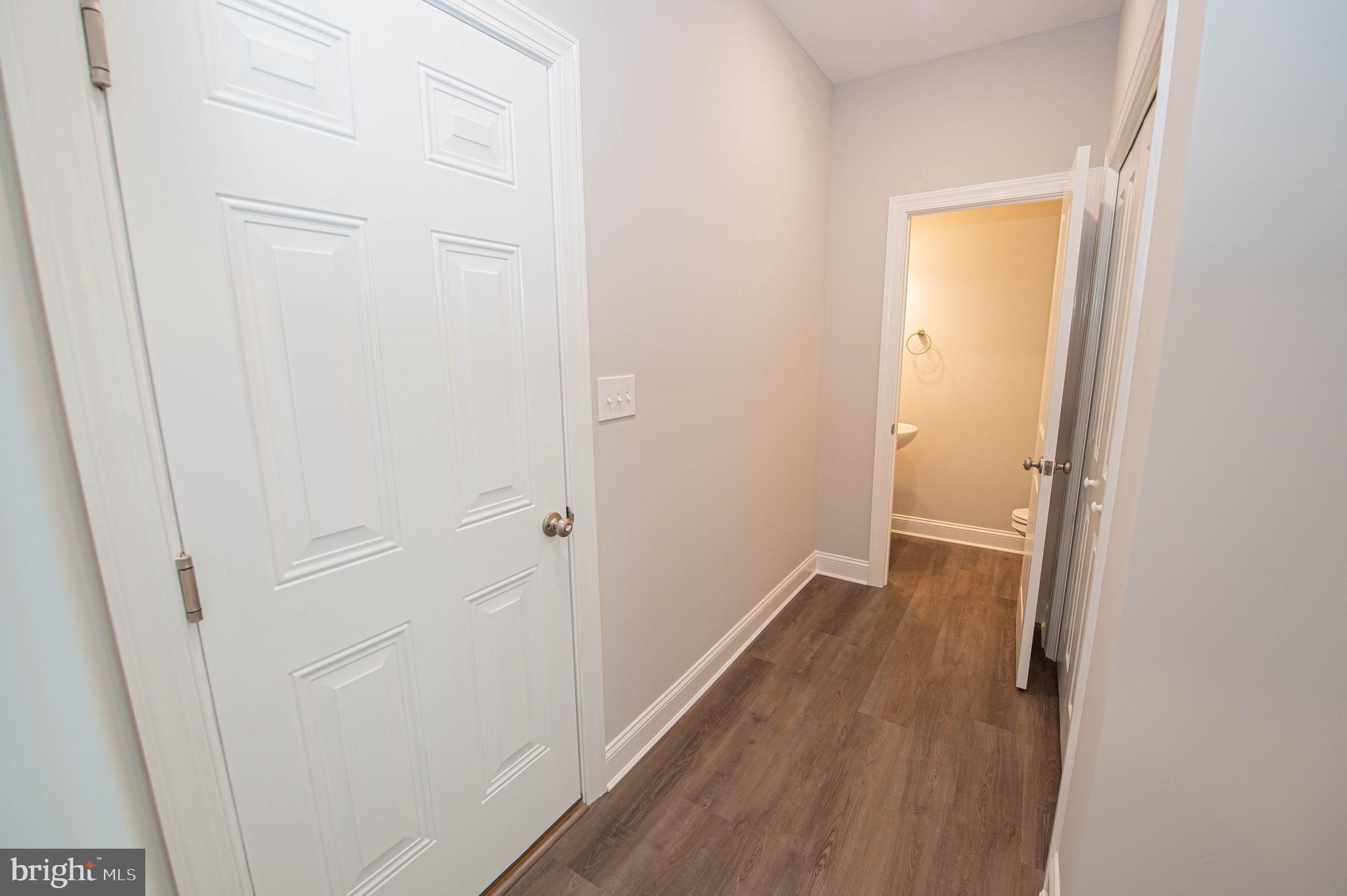 22372 Concord Pond Road Georgetown, DE 19947 - Photo 43 of 43 a view of a hallway with wooden floor