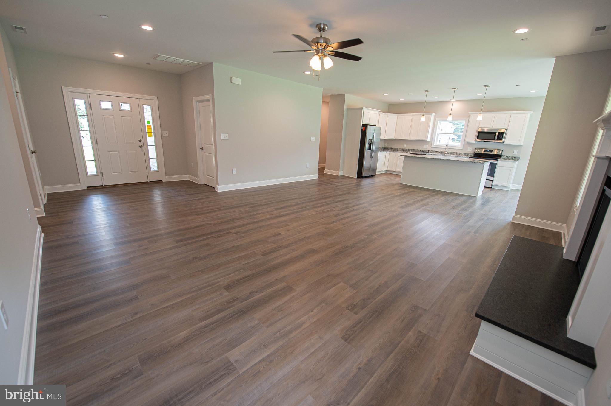 22372 Concord Pond Road Georgetown, DE 19947 - Photo 5 of 43 a view of a kitchen with a sink and a refrigerator
