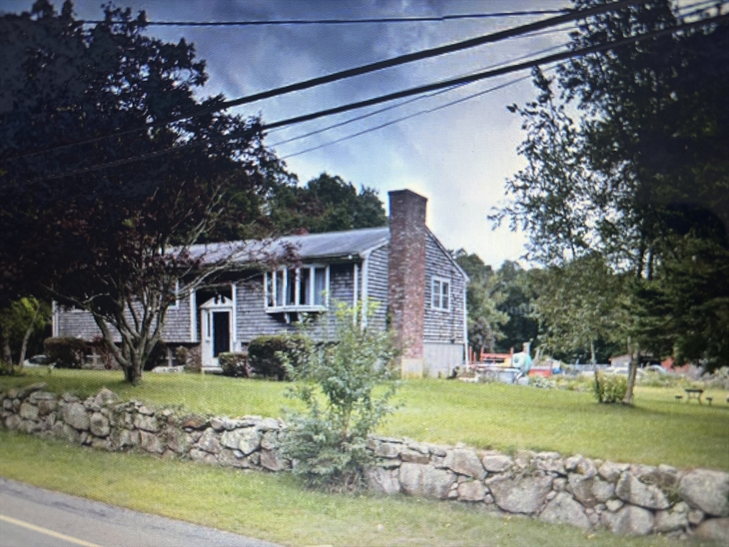 343 Old Bedford Road Westport, MA 02790 - Photo 2 of 8 a front view of a house with a garden