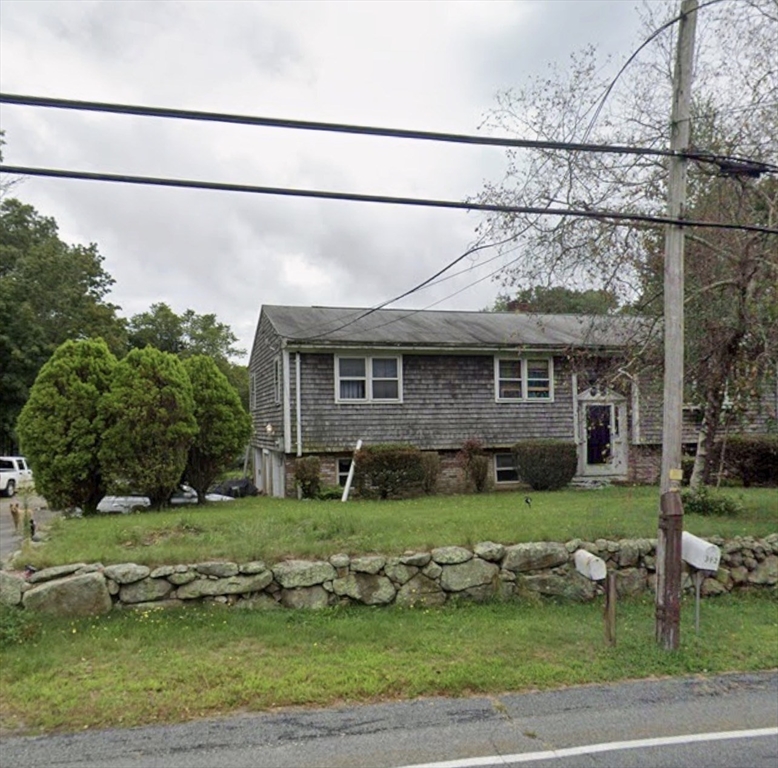 343 Old Bedford Road Westport, MA 02790 - Photo 3 of 8 a front view of a house with a yard
