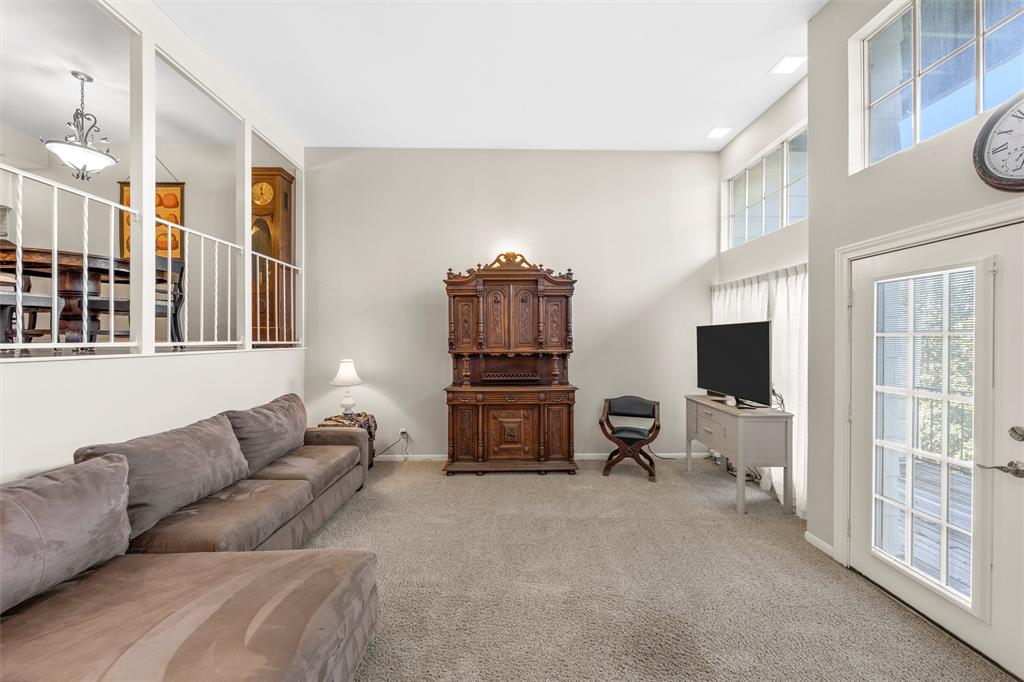 2901 Lake Shore Drive, Unit 405 Waco, TX 76708 - Photo 5 of 31 a living room with furniture and a flat screen tv