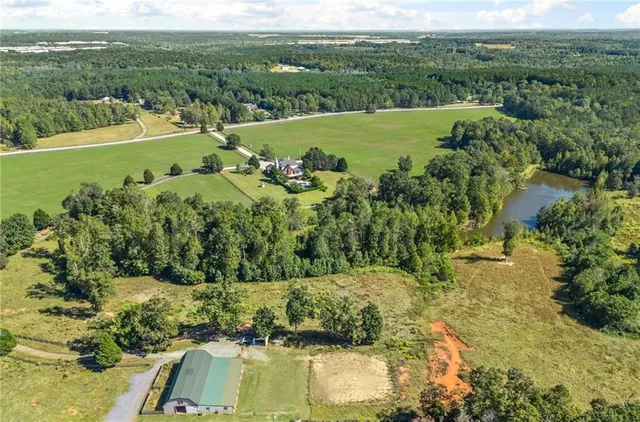 a view of an entryway with wooden floor and a window
