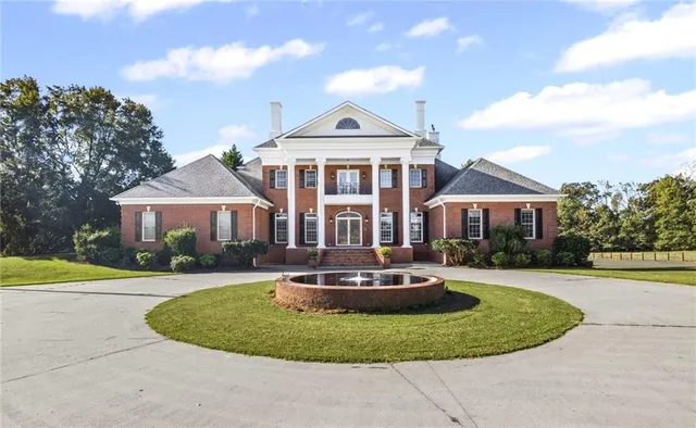 an aerial view of a house with outdoor space