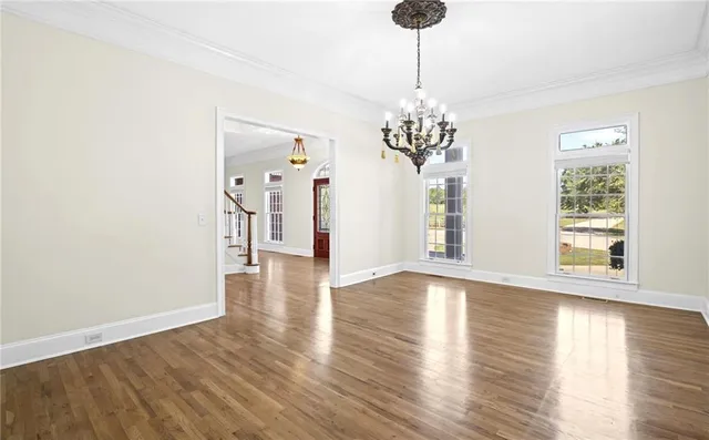 a bathroom with a granite countertop toilet and a sink