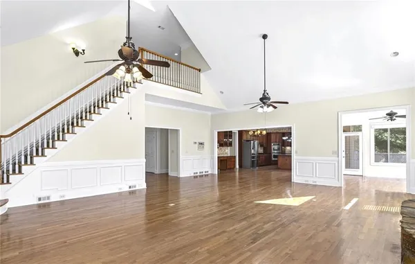 a view of balcony with wooden floor and fence