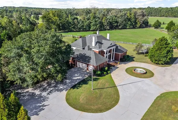 a view of a park with large trees