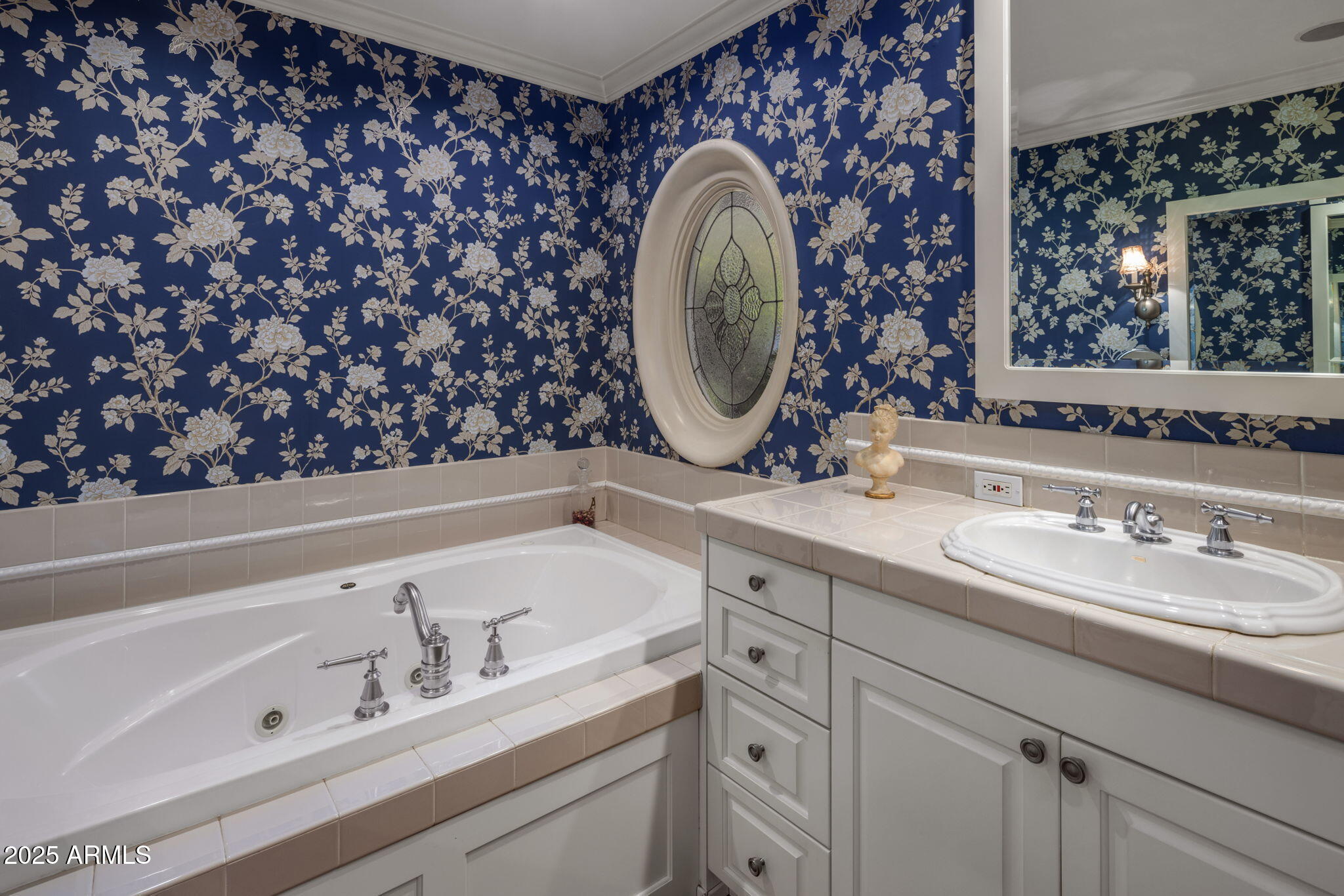 516 West Lawrence Road Phoenix, AZ 85013 - Photo 26 of 65 a bathroom with a sink and a mirror