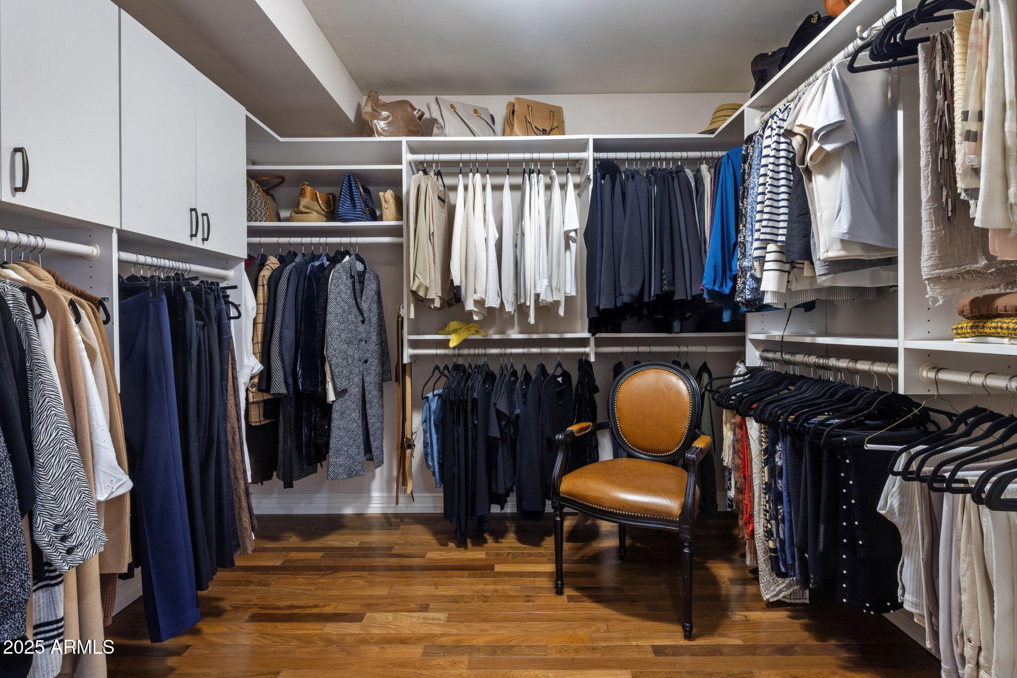 516 West Lawrence Road Phoenix, AZ 85013 - Photo 27 of 65 a view of walk in closet with clothes and shoes