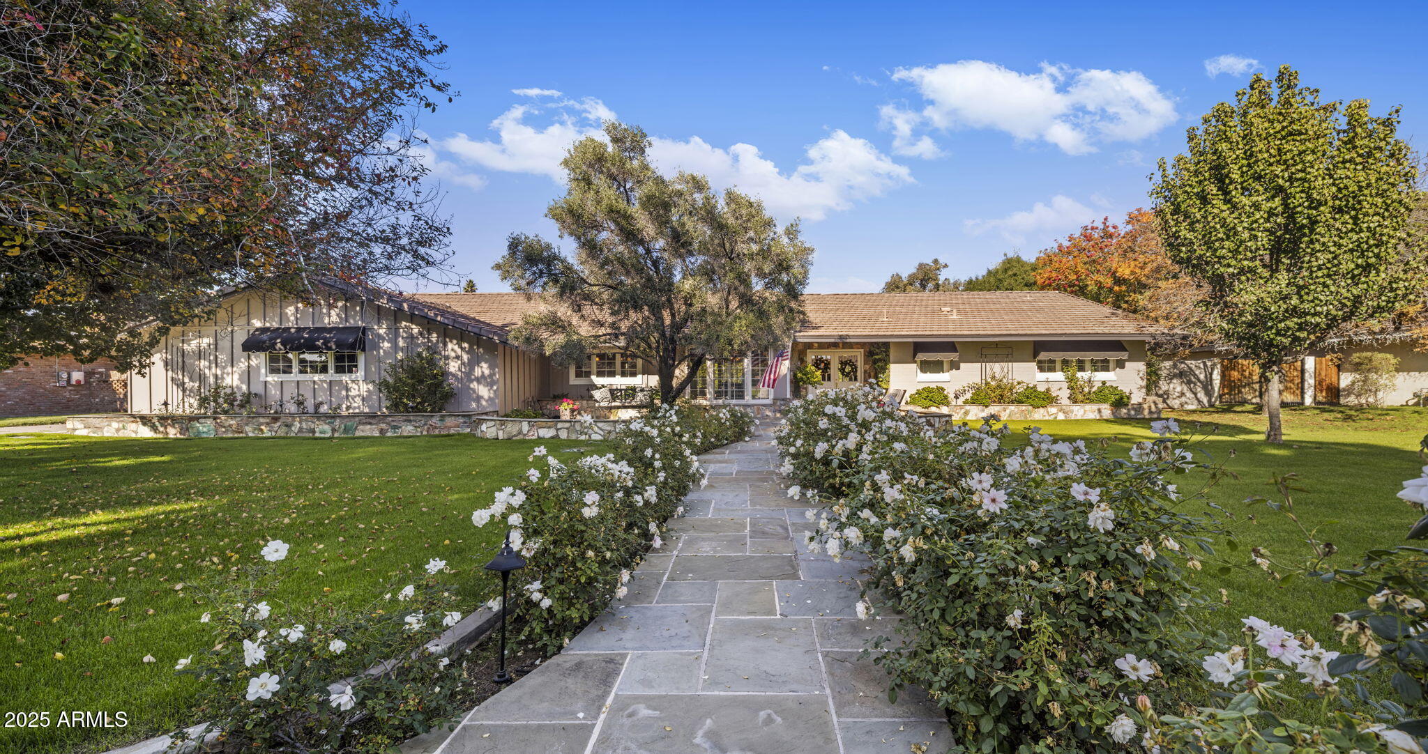516 West Lawrence Road Phoenix, AZ 85013 - Photo 2 of 65 a front view of a house with a yard