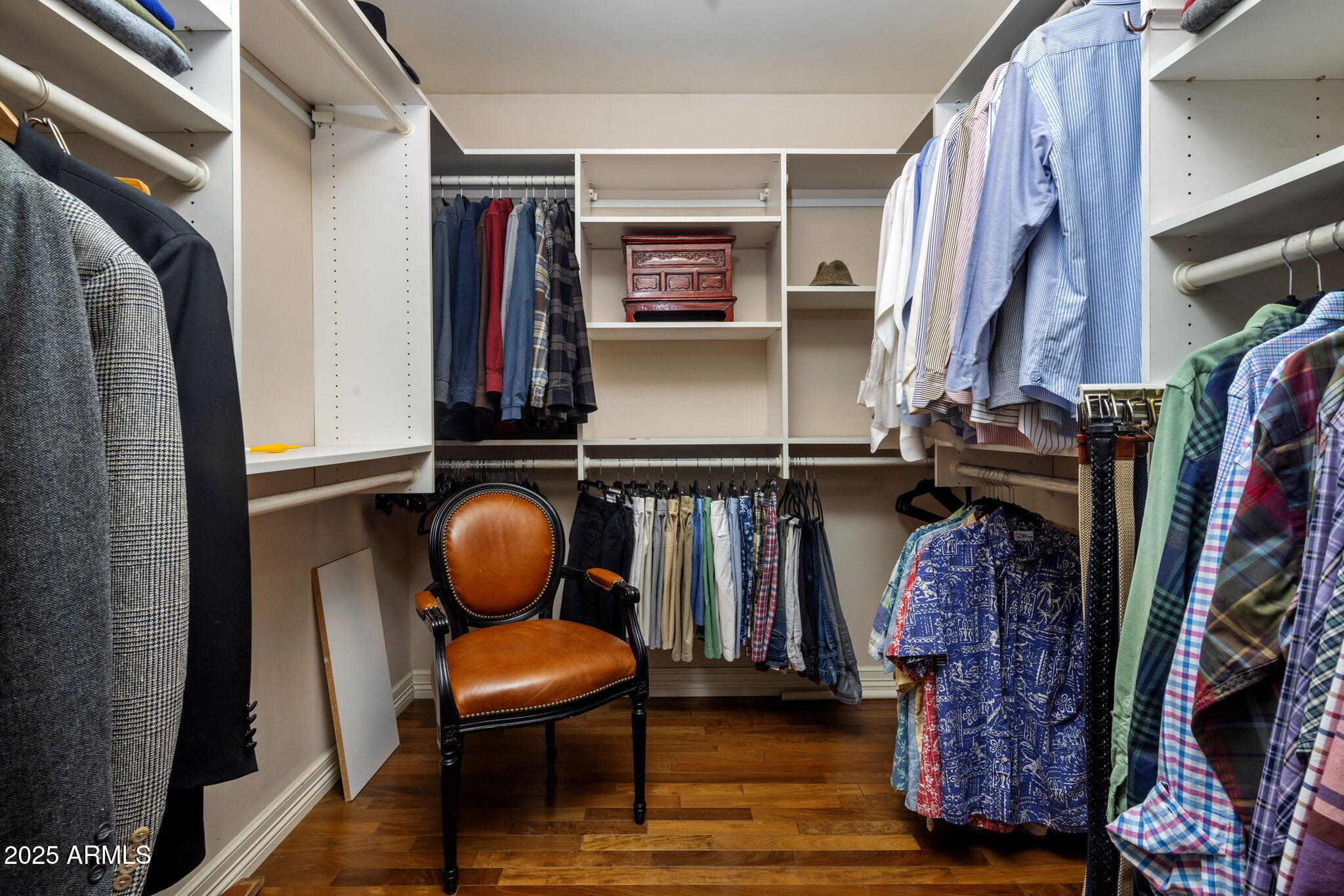 516 West Lawrence Road Phoenix, AZ 85013 - Photo 29 of 65 a view of walk in closet with clothes and shoes