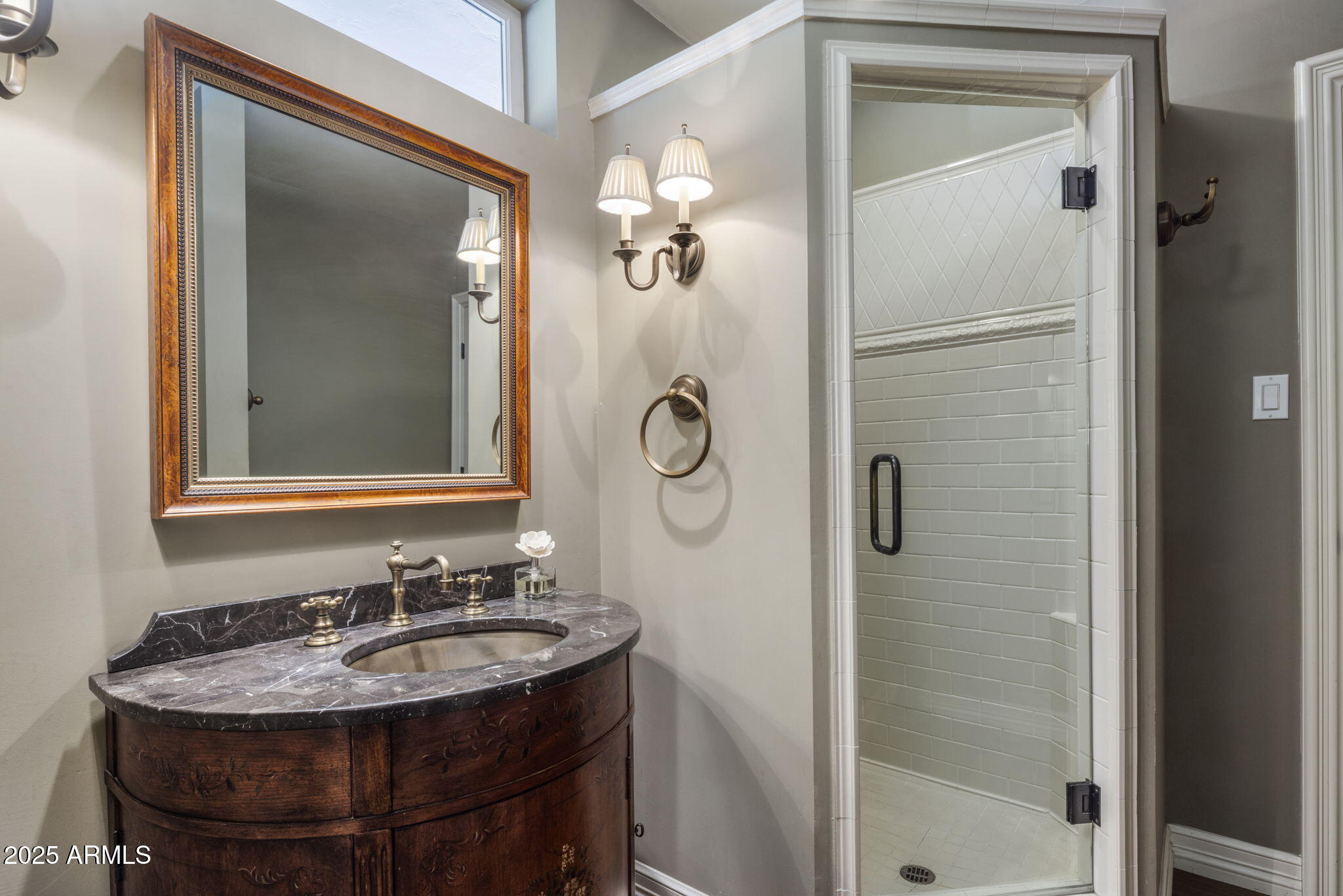 516 West Lawrence Road Phoenix, AZ 85013 - Photo 33 of 65 a bathroom with a sink and a mirror