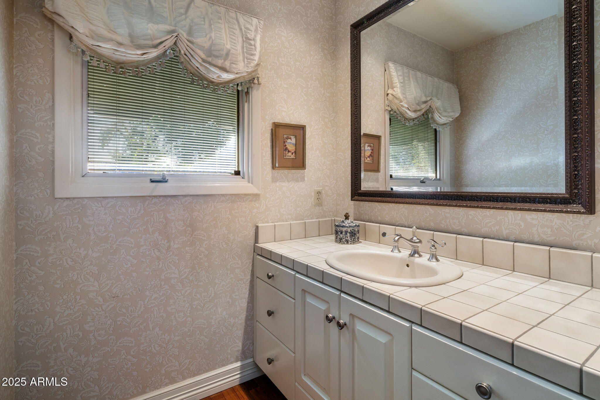 516 West Lawrence Road Phoenix, AZ 85013 - Photo 36 of 65 a bathroom with a sink and a mirror