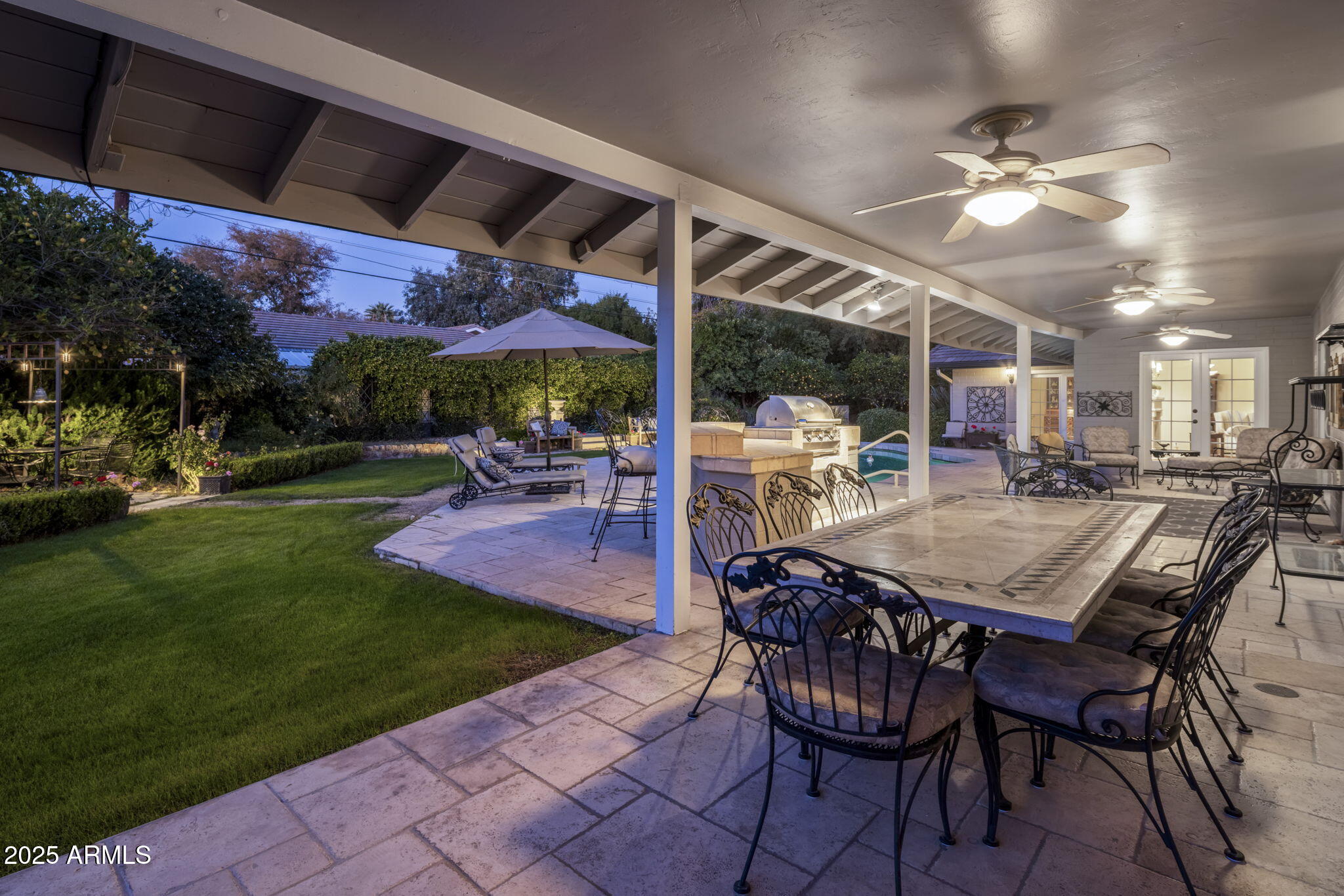 516 West Lawrence Road Phoenix, AZ 85013 - Photo 39 of 65 a view of a patio with a dining table and chairs